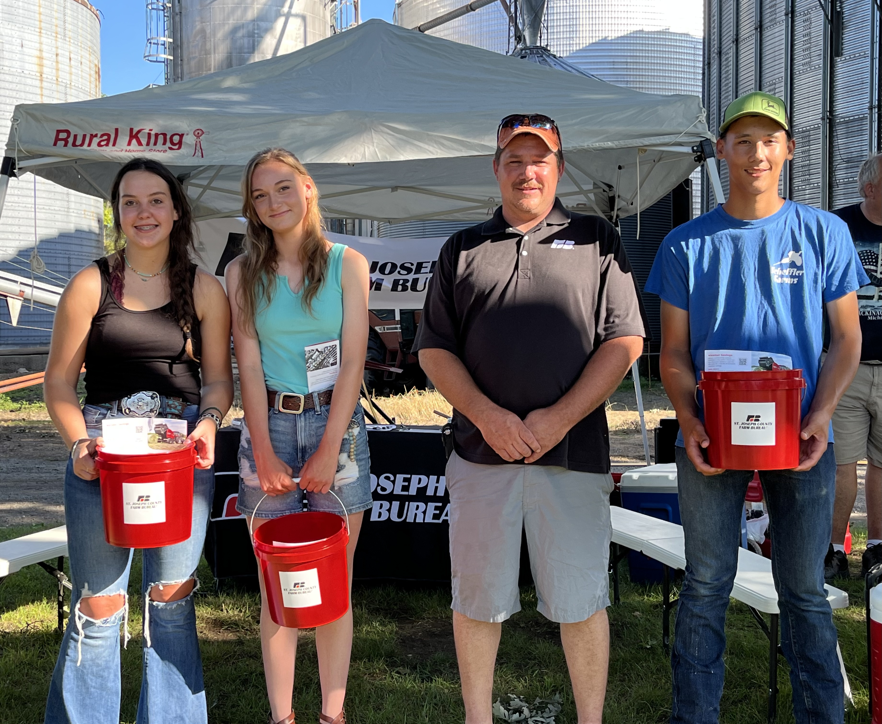 President Rich Baker presenting the State award winning FFA members from Centreville FFA with their complementary memberships.