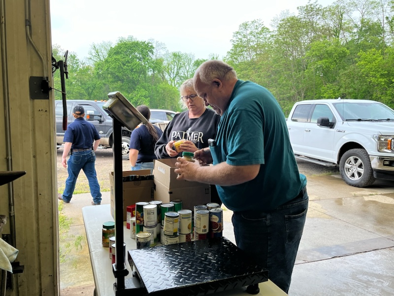 Members weighing items donated