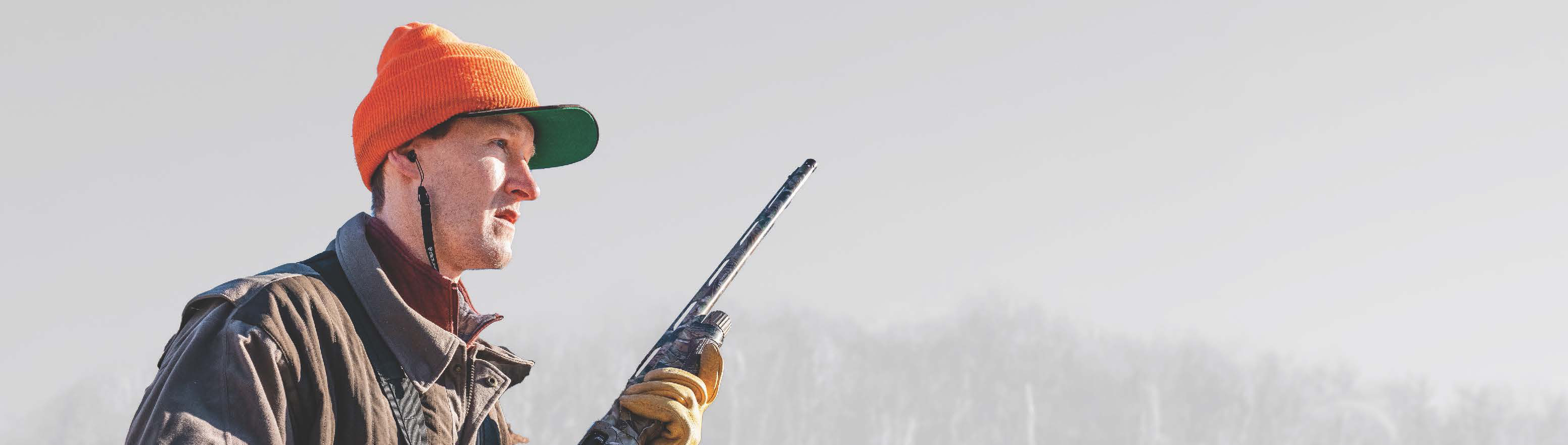 Profile shot of a hunter wearing hearing protection.
