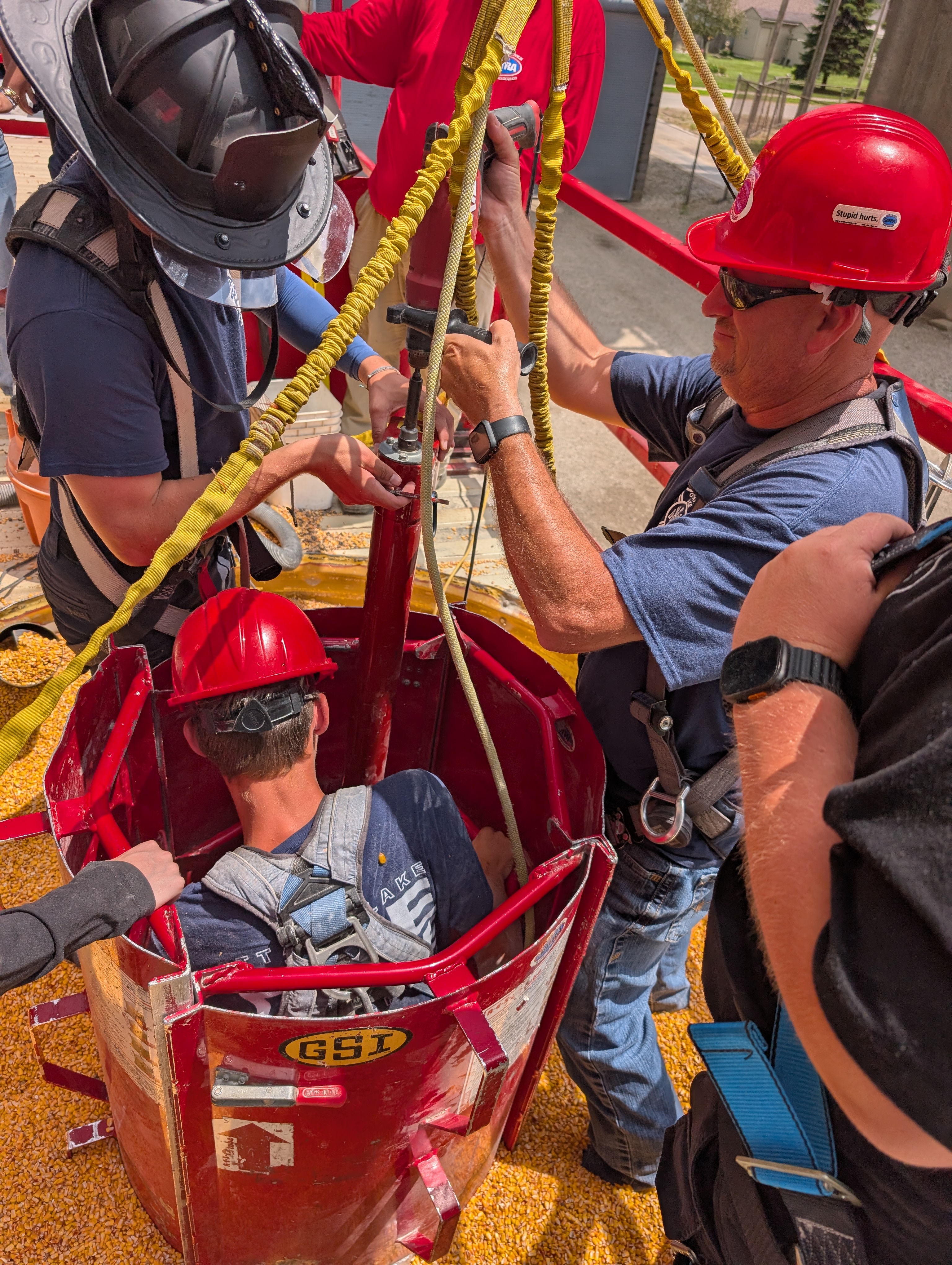 Firefighters training for grain engulfment scenario with a rescue coffer dam