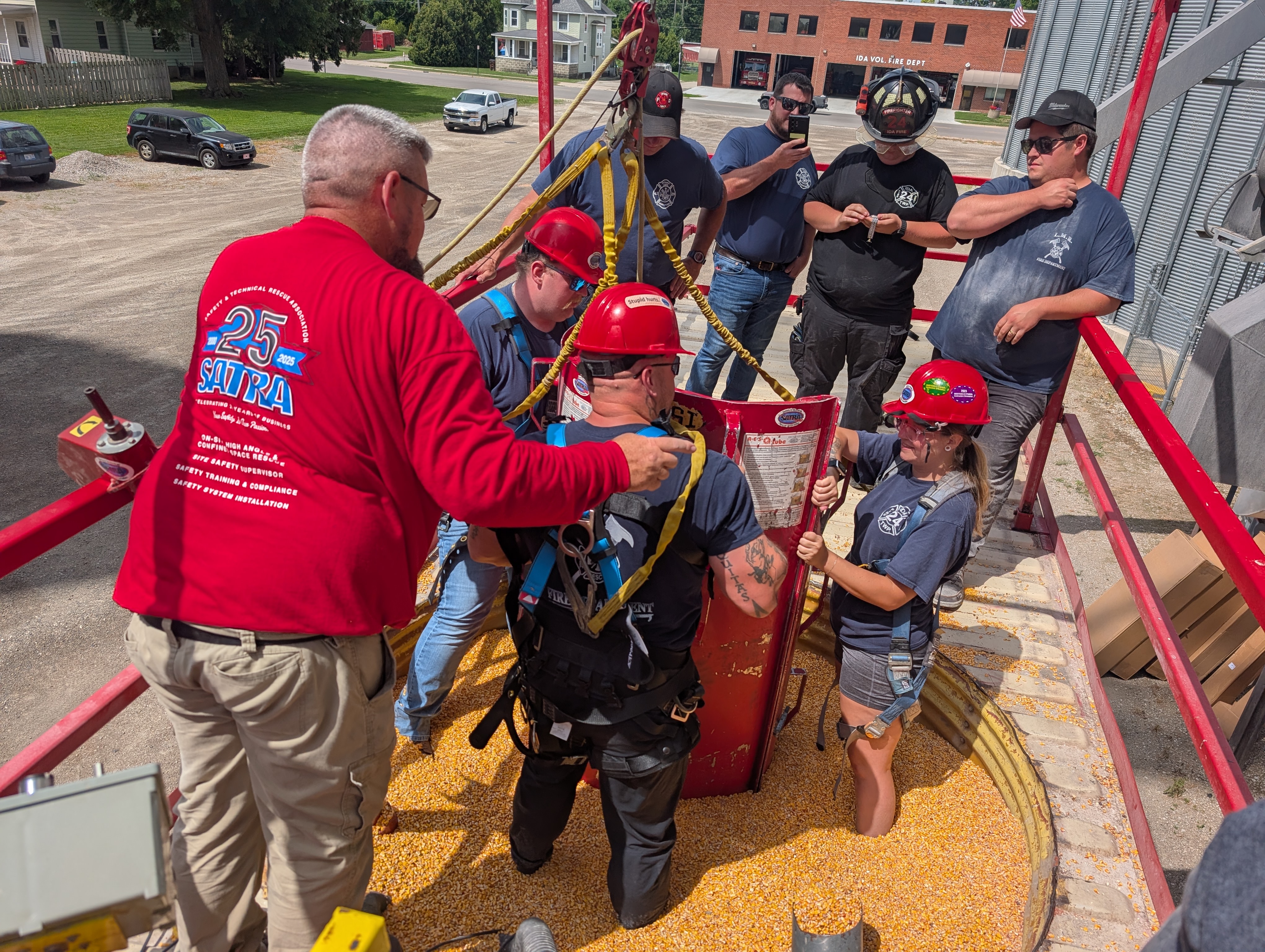 Firefighters training for a grain engulfment scenario.