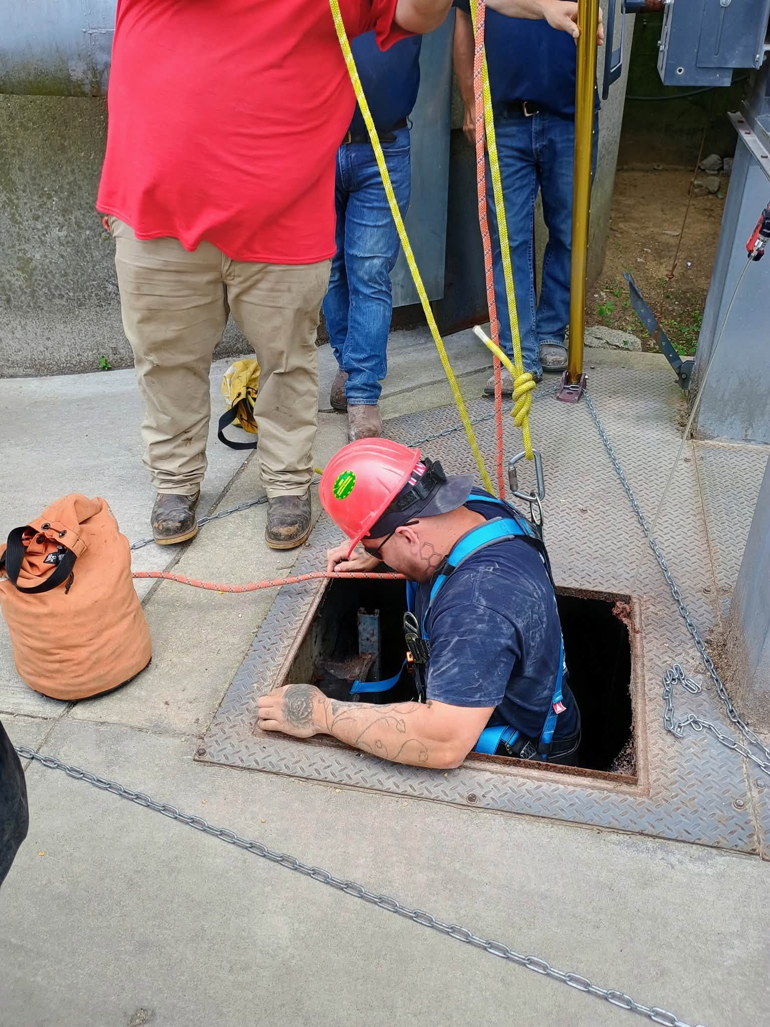 Firefighters training for a confined space scenario.