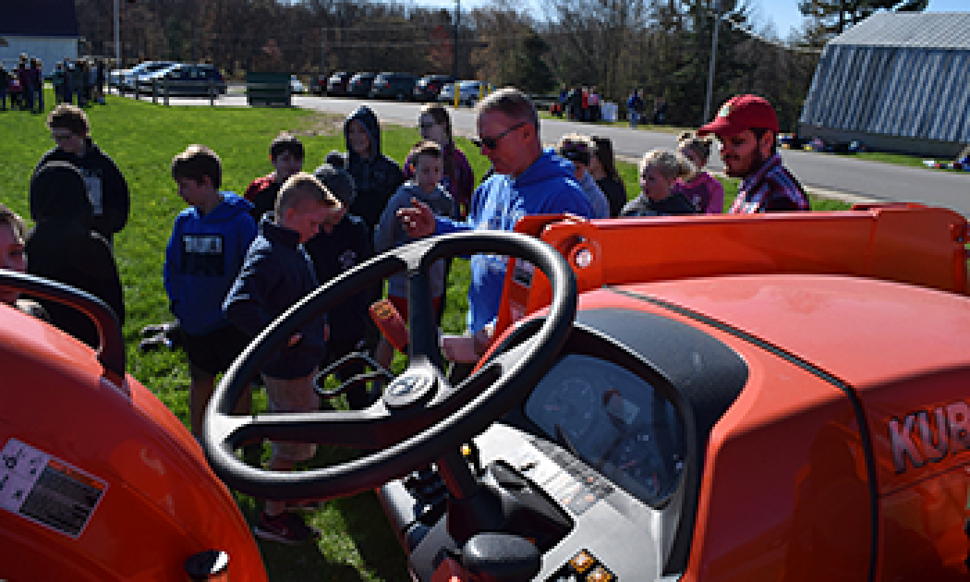 Tony Wood, surrounded by hungry young minds at Project RED. 