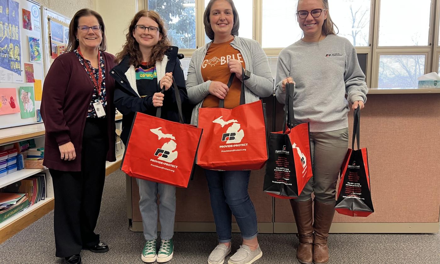 MFB Central Region Manager Nicole Jennings and Shiawassee County Farm Bureau County Administrative Coordinator Brandi Harrison delivering meals to Owosso Public Schools.