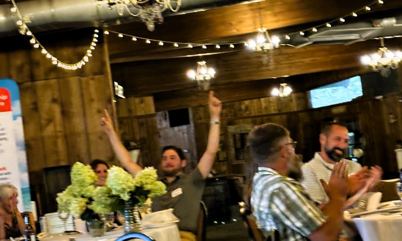 Connor Nugent wins the Young Farmer corn hole game.