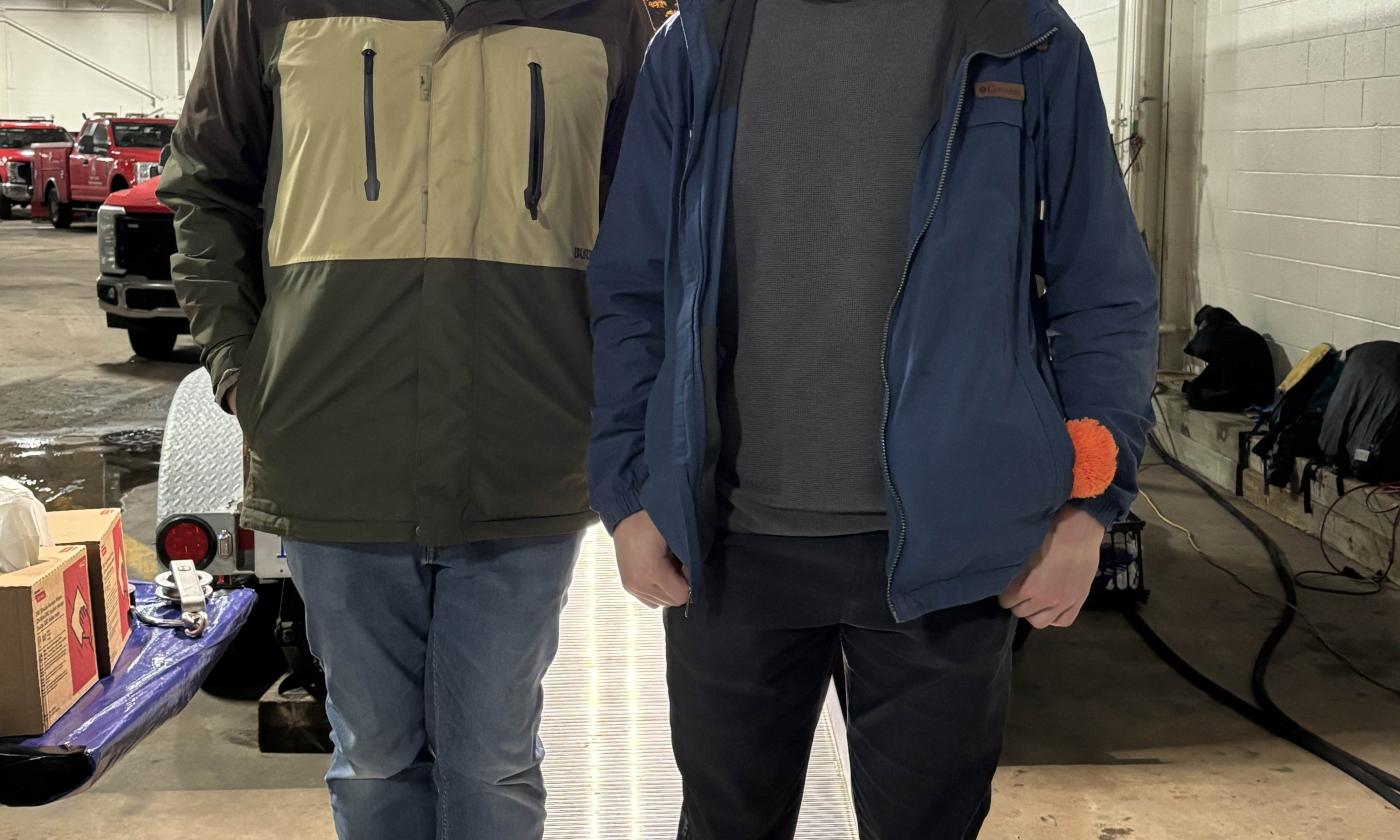 Calvin University wildlife biology professor and student conducting research at the 2025 Kent Farm Bureau Doe Pole.