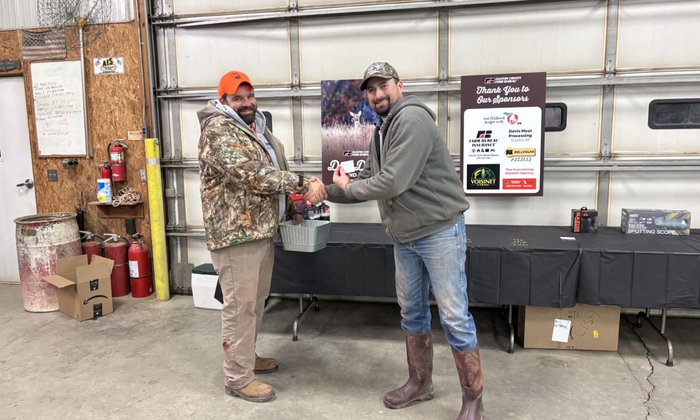 Caleb Stewart and Zach Wagner receiving a prize for most does harvested.