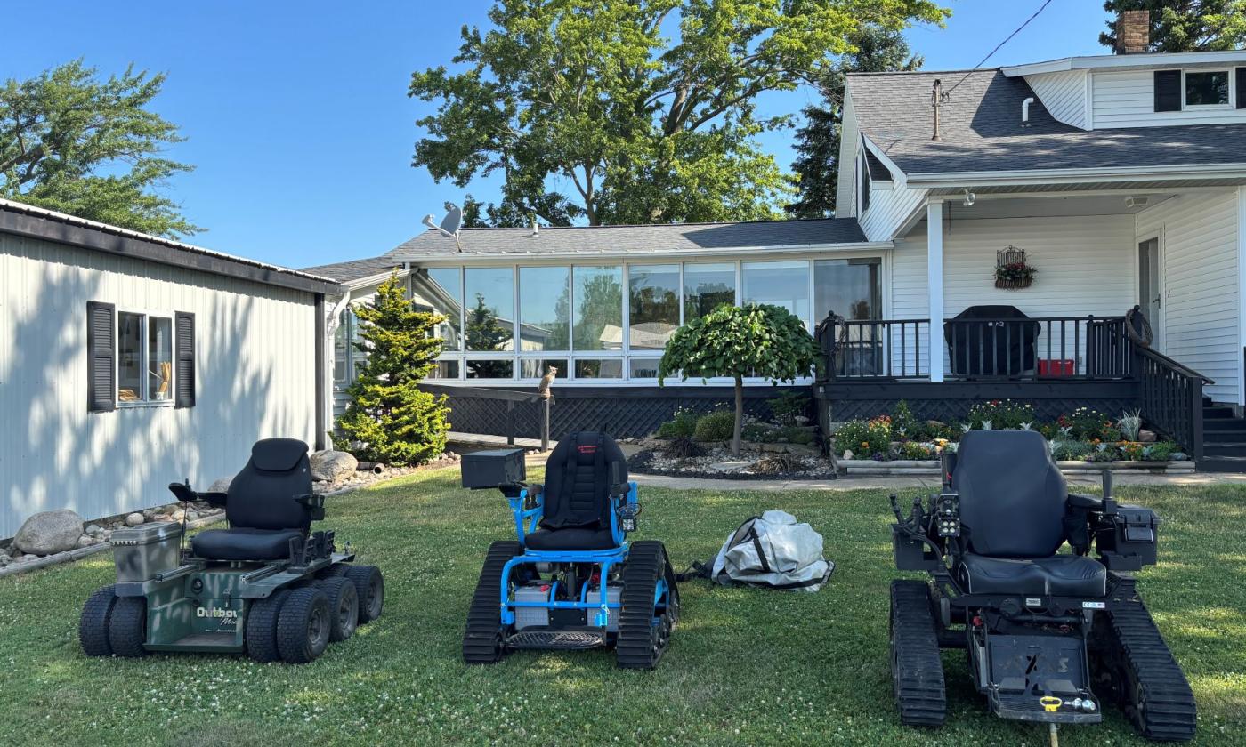 Three wheelchairs for outdoor sporting activities.