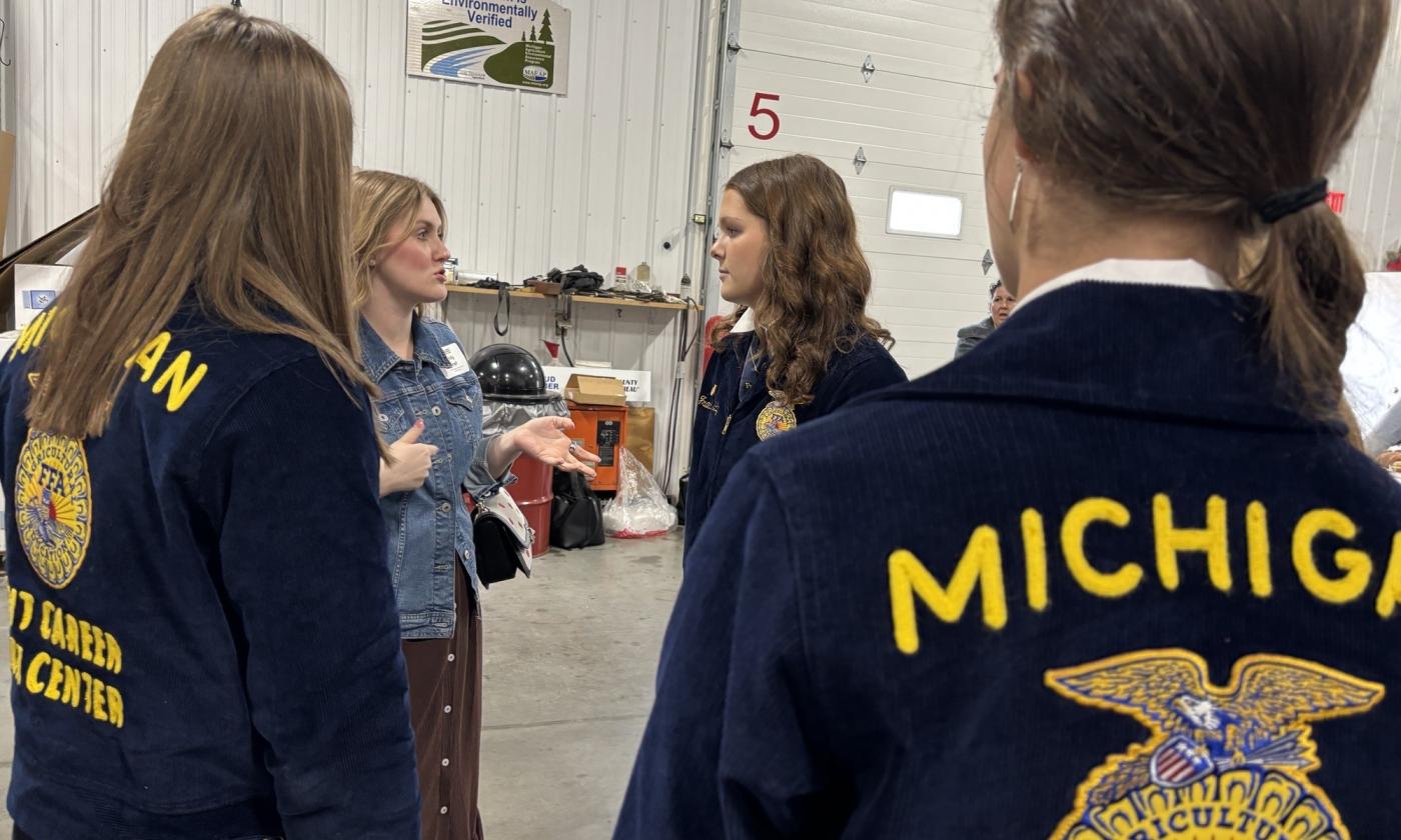 KCFB Young Farmer Co-Chair Emily Kropf talks with FFA members at Kent Legislative Breakfast.