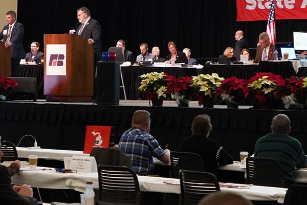 Wide shot of the populated delegate floor of the 2022 Michigan Farm Bureau State Annual Meeting.