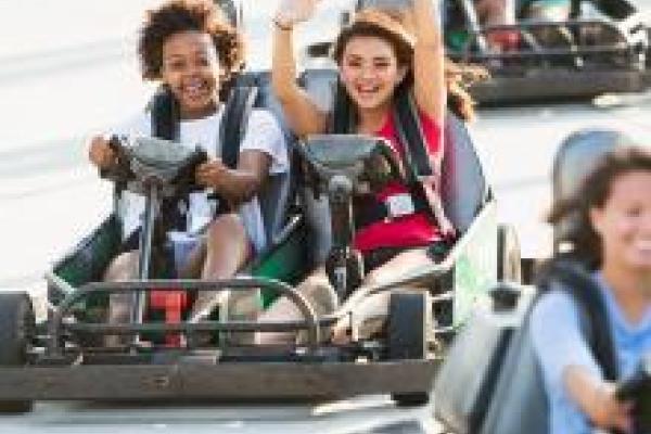 people riding go-karts