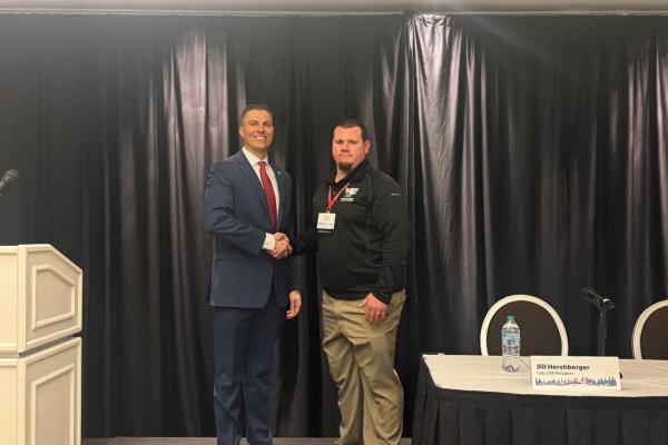 Portrait of MFB President Ben LaCross shaking hands with a county Farm Bureau president at the 2025 Council of Presidents Conference.