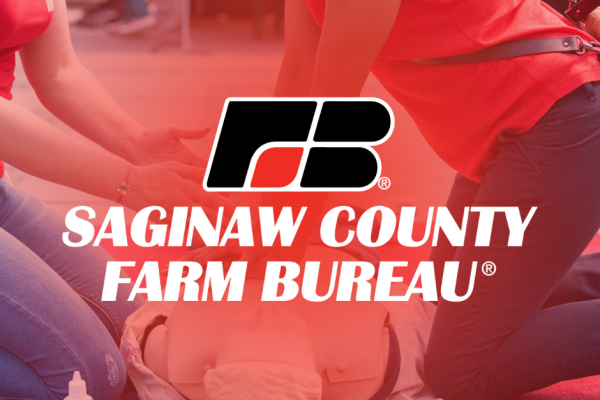 Saginaw County Farm Bureau logo over an image of two people performing CPR on a test doll