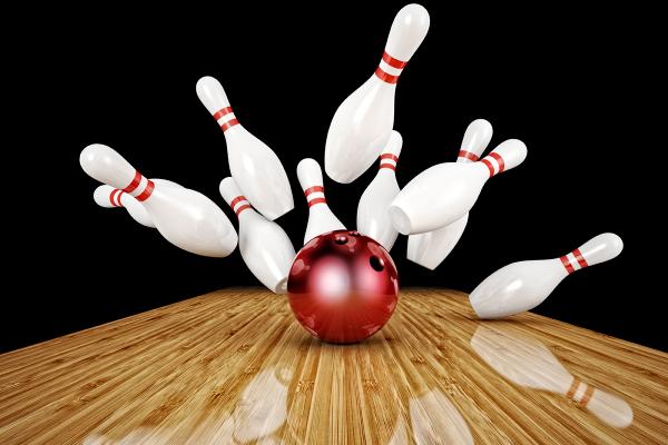 A bowling ball hitting bowling pins.