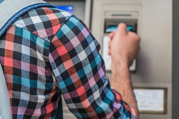 Man using an ATM.