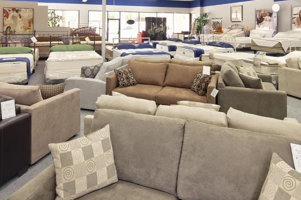 Seating furniture and mattresses displayed in a store.