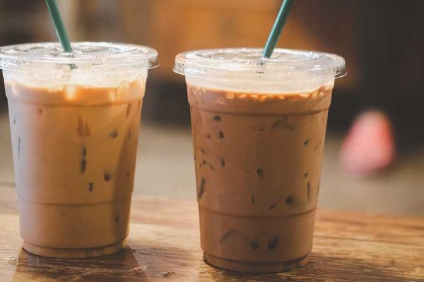 Iced coffee latte on wooden table.
