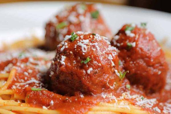 Close-up of a plate of spaghetti and meatballs.
