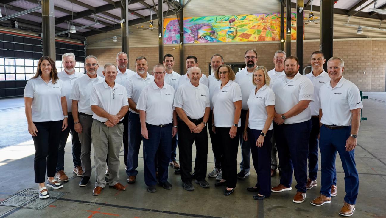 Portrait of the Michigan Farm Bureau Board of Directors smiling at the camera while standing in the Eastern Market.