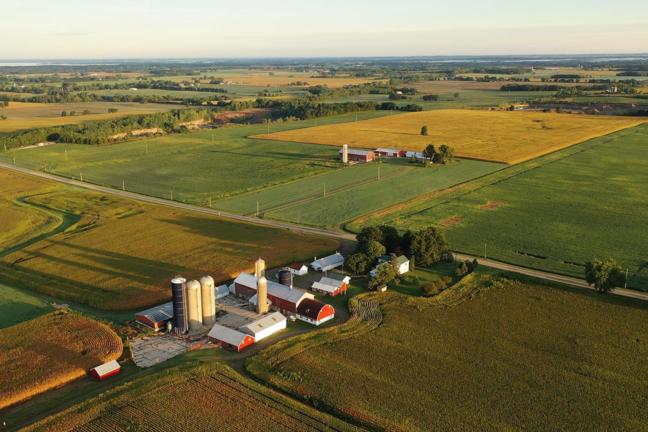 Wide aerial shot of a plot of farm land.