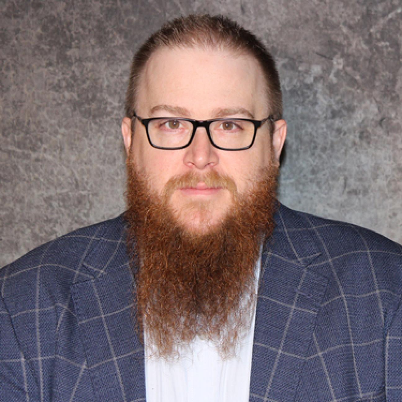 Justin Tomei headshot.