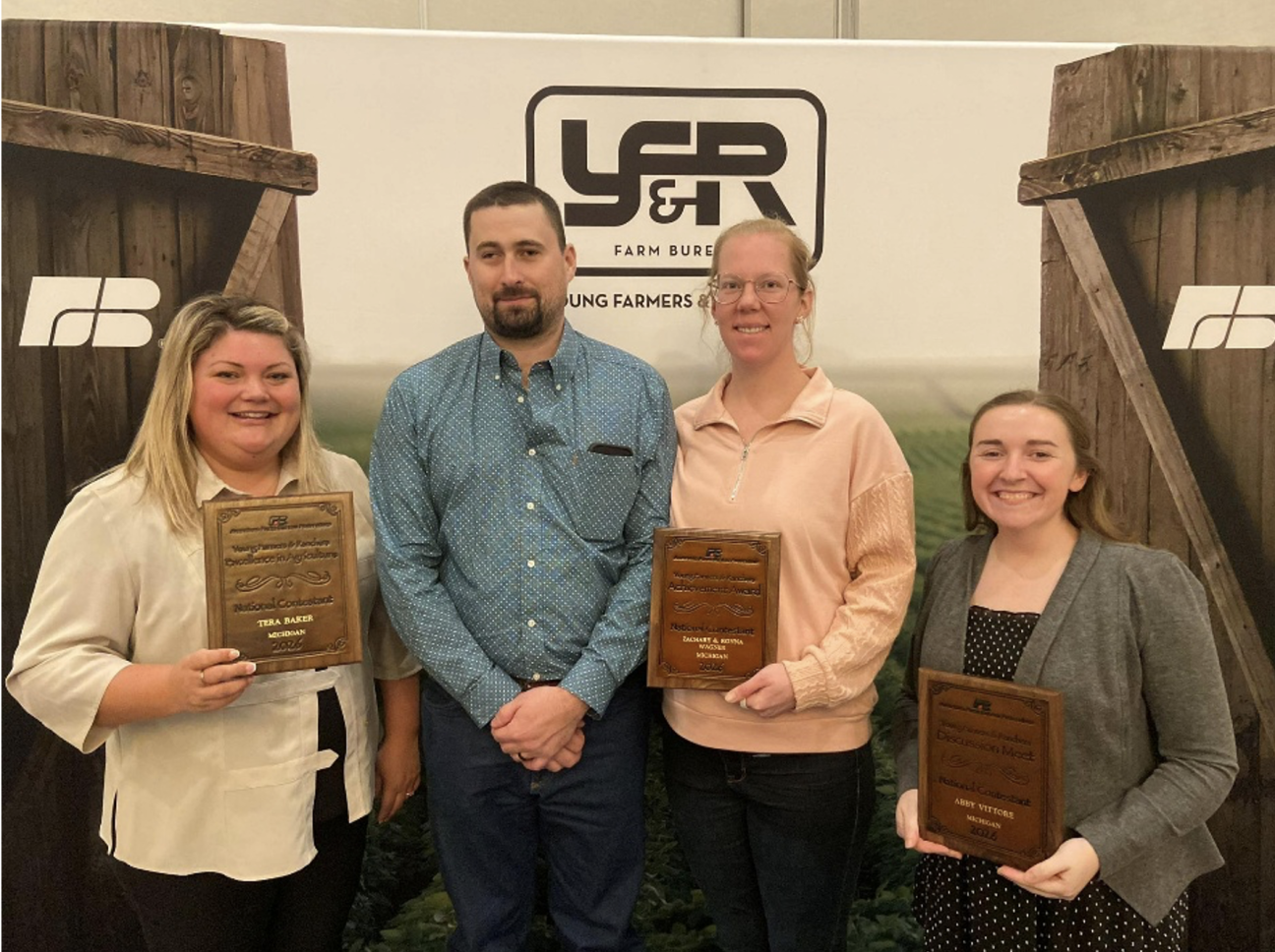 Portrait of Excellence in Agriculture winner Tera Baker, MFB Achievement award winners Zach and Ronna Wagner, and MFB Young Farmer Discussion Meet winner Abby Vittore.