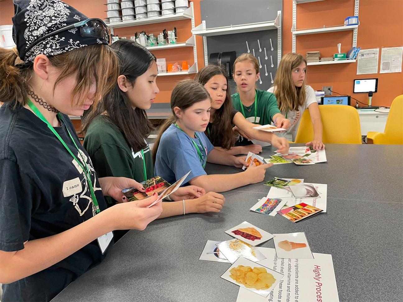 Young students participating in an agriculture lesson in their classroom.