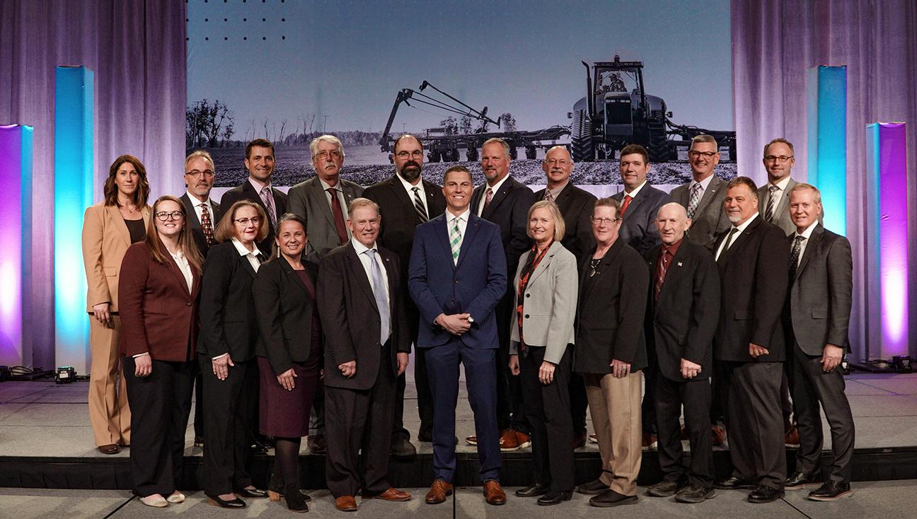 Portrait of the Michigan Farm Bureau Board of Directors smiling at the camera while standing in the Eastern Market.