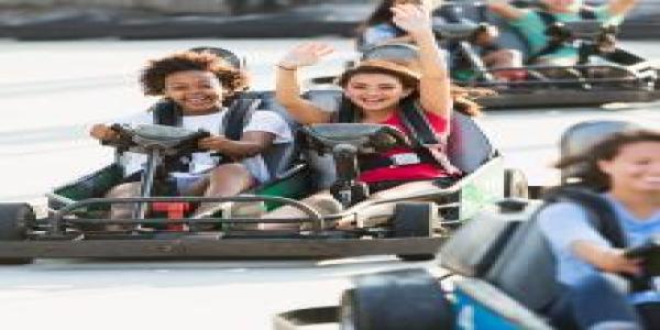 people riding go-karts
