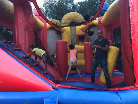 Michigan Farm Bureau CEO Scott Piggott (left) visits with Berrien member Brett Marschke and his family.