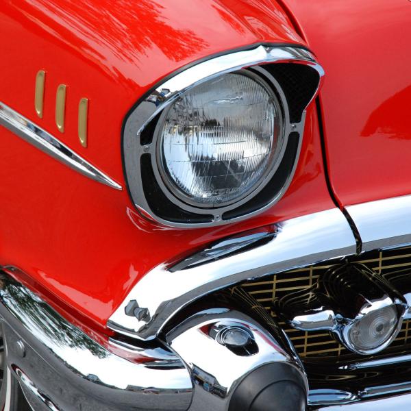 close up of a classic car's front headlight