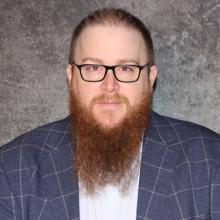 Justin Tomei headshot.