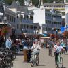 Wide shot of the streets of Mackinac Island filled with people on bicycles.