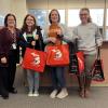 MFB Central Region Manager Nicole Jennings and Shiawassee County Farm Bureau County Administrative Coordinator Brandi Harrison delivering meals to Owosso Public Schools.