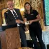 Outgoing Kent County Farm Bureau President Kylee Zdunic-Rasch receives gift from MFB Director Jeff Sandborn.