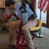 Ned Stoller of Michigan AgrAbility demonstrates a piece of adaptive equipment he created.