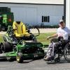 Doug VerHoeven demonstrating his adapted riding mower.