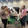 Annie Link talks with a group at MiCareer Quest at the Picture Yourself in Agriculture booth.