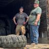 Board members loading tires at the tire recycling event.