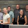 Kent County Farm Bureau Board members hand out scholarships to local students.