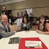 Board members Bruce Klamer and Nicole Zaagman talk with Rep. Angela Rigas at a Lansing Legislative Seminar.