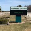 Outdoor sign reading "Greenwood Township – Welcome!"